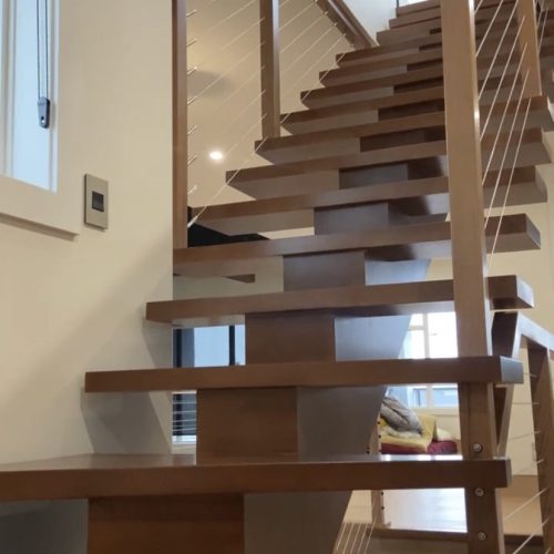 Cable Railing With Walnut Stair
